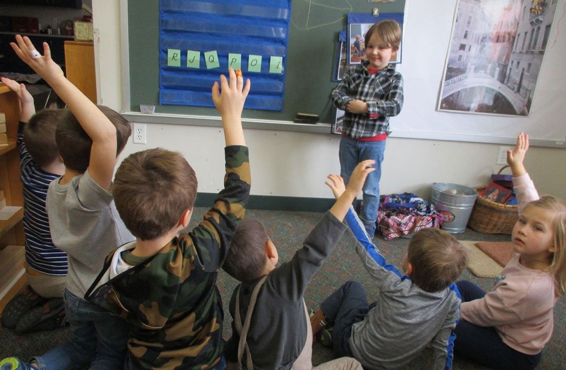 student presenting in front of class