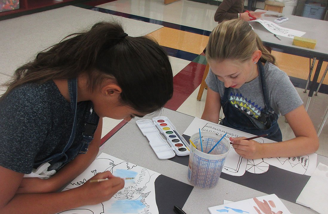 middle school students painting