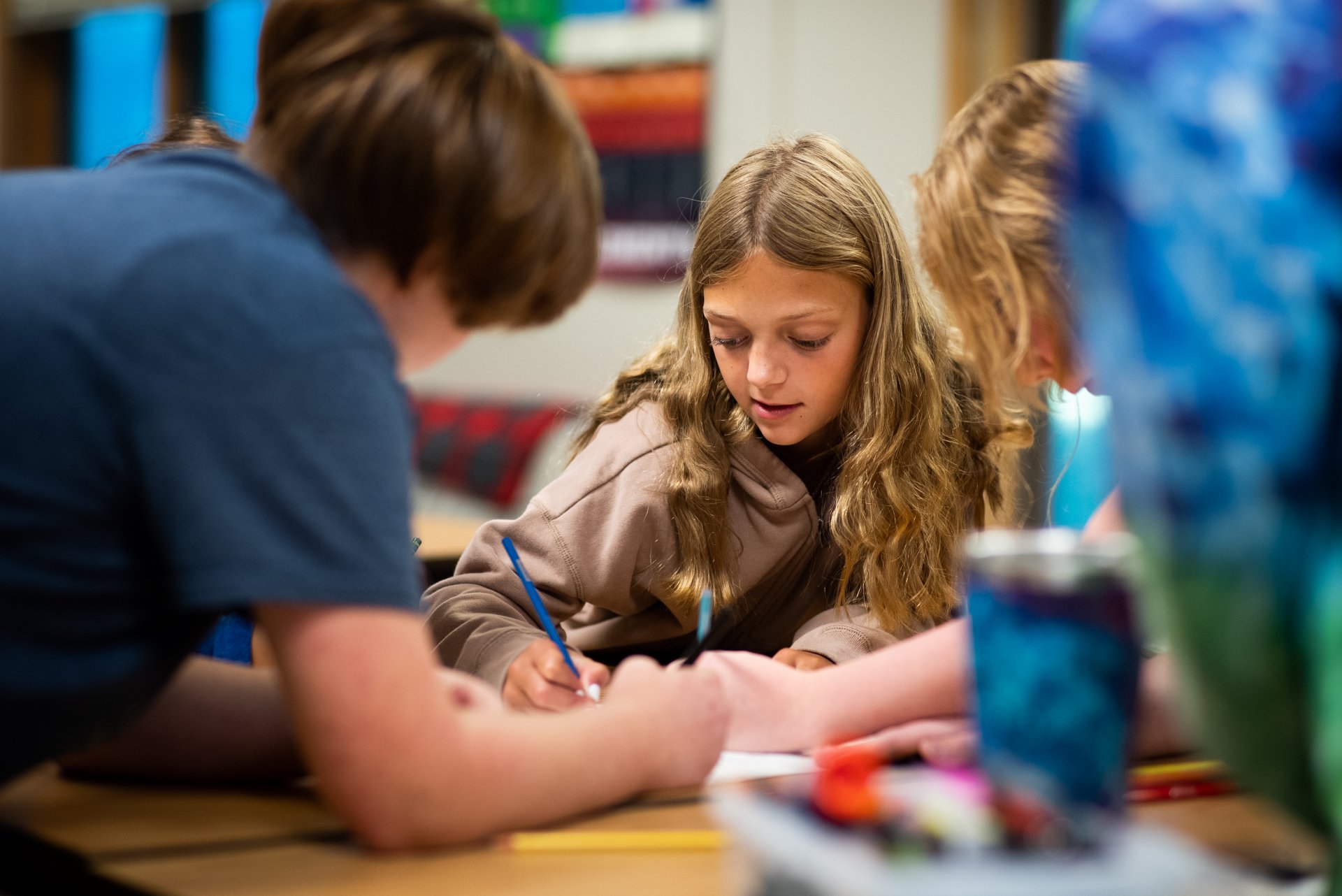 student and teacher working together